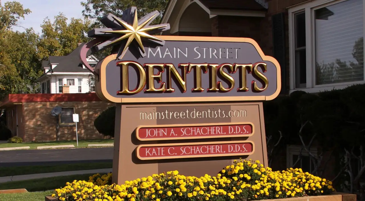 The Main Street Dentists sign on North Main Street in Verona, naming Dr. John A. Schacherl and Dr. Kate C. Schacherl.