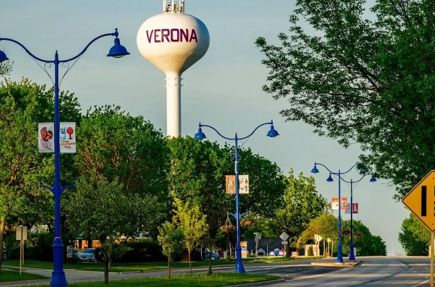 Main Street in Verona, Wisconsin, with the Verona water tower above the trees.
